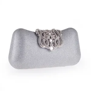 Exquisite silver evening clutch bag detail showcasing rhinestone clasp and sparkling finish.