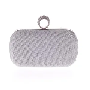 Silver rhinestone ring clutch bag detail, elegant evening purse detail view, glitter box bag.