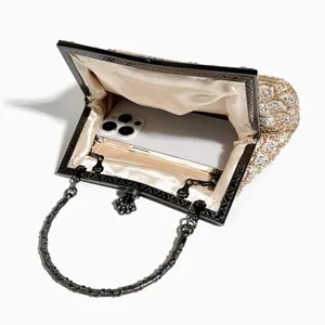 Exquisite beaded evening clutch bag interior detail showcasing spacious capacity for phone.