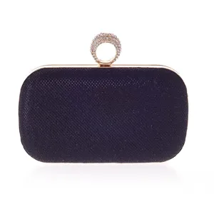 Black glitter evening clutch bag with gold metal frame and rhinestone ring handle for women.