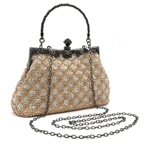 Beaded evening bag detail showing intricate fishscale embroidery and vintage metal frame clasp.