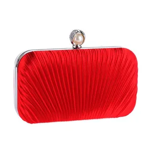 Elegant red pleated evening clutch bag with pearl rhinestone clasp for women parties.