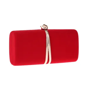 Red velvet evening clutch bag detail, exquisite metal wavy strap design, elegant fashion accessory.