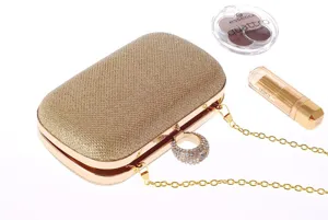 Gold glitter evening clutch bag with sparkling rhinestone ring handle and metal chain strap for women.