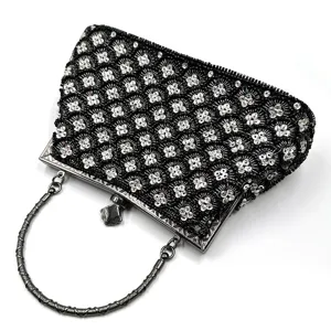 Black sequin evening bag with metallic round handle, elegant clutch purse for women party.