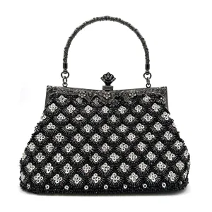 Elegant black beaded evening bag with metal handle and vintage clasp for women party.