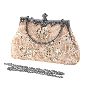 Exquisite beaded evening bag detail showing intricate floral sequins and vintage metal frame.