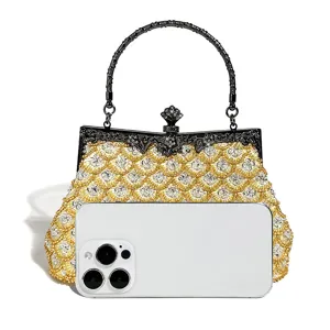 Sparkling sequin evening clutch bag with metallic handle and vintage clasp detail for special events.