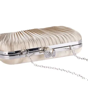 Elegant pleated evening clutch bag with pearl rhinestone clasp and metallic chain strap for women.