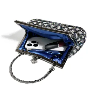 Exquisite beaded evening clutch with shimmering fish scale pattern and elegant blue satin lining.