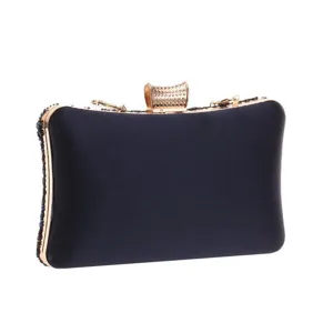 Elegant dark blue satin evening clutch bag with gold metallic frame and beaded embroidery.