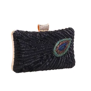 Elegant black sequin evening clutch bag with beaded peacock feather detail and rhinestone clasp.