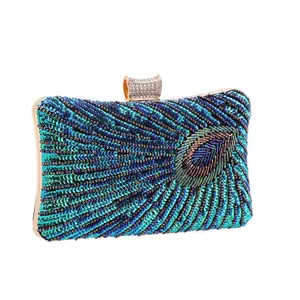 Stunning peacock beaded clutch bag with sequins and gold hardware, perfect for evening parties.