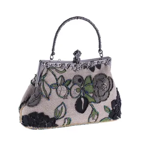 Vintage beaded evening bag detail showing intricate floral embroidery and metallic kiss-lock closure.