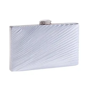 Silver pleated evening clutch bag featuring a sparkly rhinestone clasp detail for party wear style.