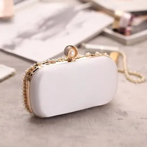 Pearl satin evening clutch bag detail view, elegant bridal wedding party crossbody bag with diamonds.