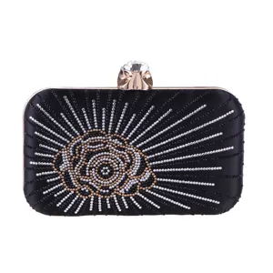 Exquisite rhinestone evening clutch bag with black satin hard box and sparkling crystal clasp.