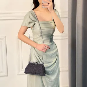 Elegant beaded evening clutch bag with chain strap for women banquets, glamorous party purse.