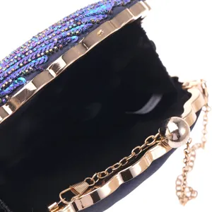 Sequined evening clutch purse with gold-tone metal frame and chain strap for parties.