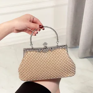 Elegant pearl beaded evening bag with metal handle, vintage kiss-lock clutch for parties.