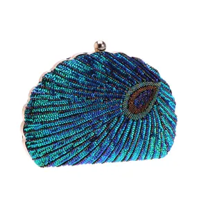 Elegant sequin beaded evening clutch bag with shell shape and peacock feather design.