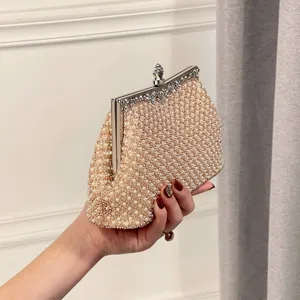 Elegant pearl evening clutch bag for women, sparkling rhinestone beaded wedding party handbag detail view.