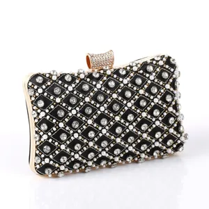 Detailed close-up view of the black rhinestone pearl evening clutch bag sparkle design.