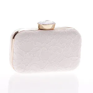 Bolso de mano de encaje blanco para mujer, elegante cartera de noche con marco dorado.