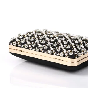 Elegant black satin evening clutch bag decorated with pearls and crystal rhinestones.