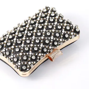 Elegant black evening clutch bag with sparkling rhinestones and pearls, gold frame detail.