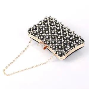 Exquisite rhinestone pearl evening clutch bag detail view, luxury party wedding purse accessories.