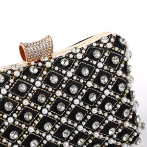 Exquisite rhinestone and pearl evening clutch bag detail, elegant party purse for women.