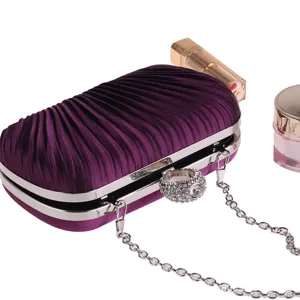 Purple pleated evening clutch bag with silver chain and rhinestone ring clasp detail