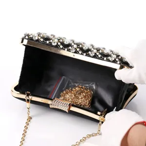 Elegant black evening clutch with pearls and rhinestones, gold chain shoulder bag for party wedding.