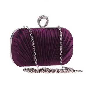 Purple pleated evening clutch bag detail showing elegant rhinestone ring clasp and silver chain.
