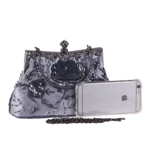 Vintage beaded evening bag with exquisite rose embroidery, metal frame and chain strap.