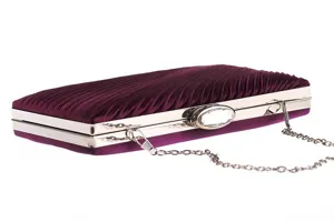 Detail view of the elegant dark purple pleated evening clutch bag with crystal clasp.