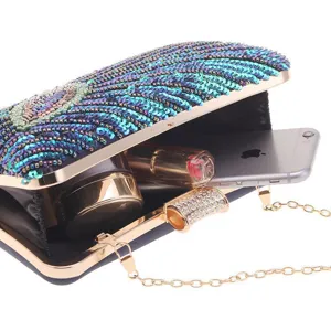 Exquisite beaded sequin evening clutch detail showing spacious interior and golden chain strap.