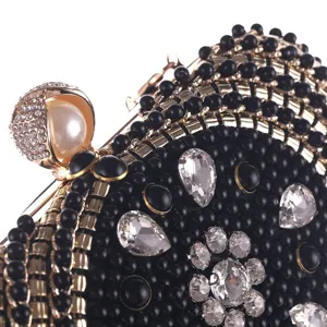 Detailed view of women evening crystal clutch bag, black beaded hard shell shoulder purse.