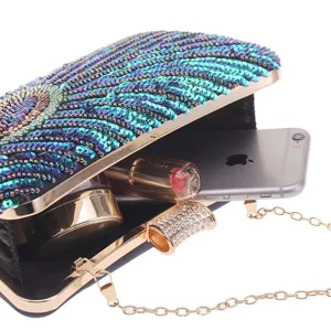 Detail view of luxury sequin peacock clutch bag, showing interior capacity with chain strap.