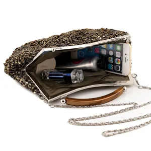 Vintage beaded evening clutch bag with metal frame and elegant chain strap for women.