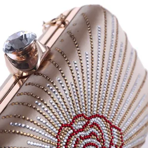 Elegant champagne crystal evening clutch bag detail showcasing sparkling rhinestones.