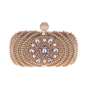 Exquisite pearl evening clutch bag featuring stunning rhinestones and elegant gold clasp details.