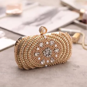 Elegant gold beaded evening clutch bag with sparkling crystals and faux pearl clasp.