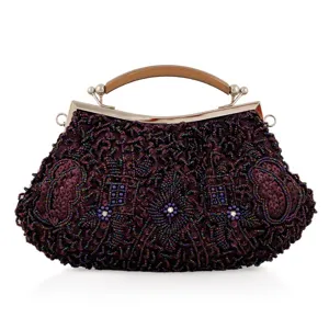 Close-up detail of vintage beaded evening clutch bag with intricate purple beadwork and metal frame.