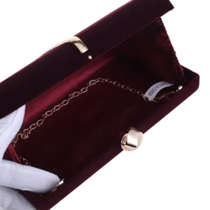 Burgundy velvet evening clutch bag with gold chain strap for women elegant party purse.