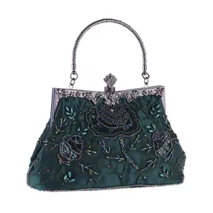 Vintage dark green beaded evening bag with exquisite floral embroidery and metal handle for banquet.
