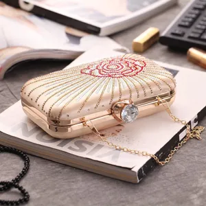 Gold hard box evening clutch bag with sparkling rhinestones, crystal clasp and metal chain.