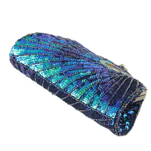 Exquisite sequined beaded evening clutch bag with intricate peacock feather embroidery details.