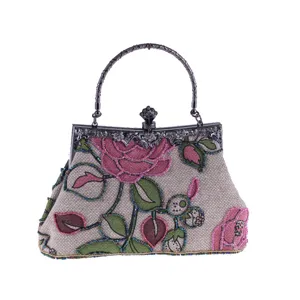 Ethnic beaded evening handbag with linen fabric, vintage floral embroidery and metal handle.